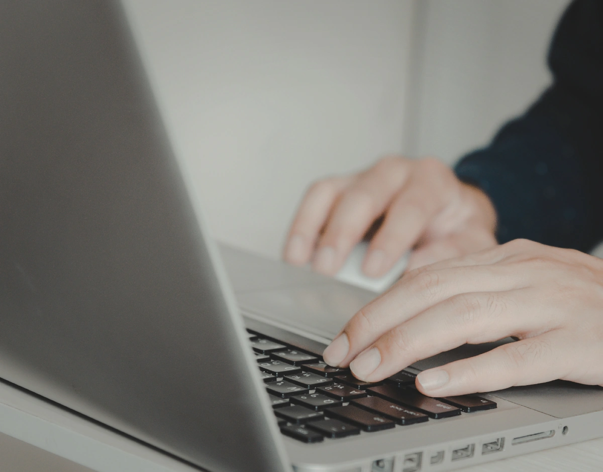 Person working on a laptop, representing IT support for charities and non-profits