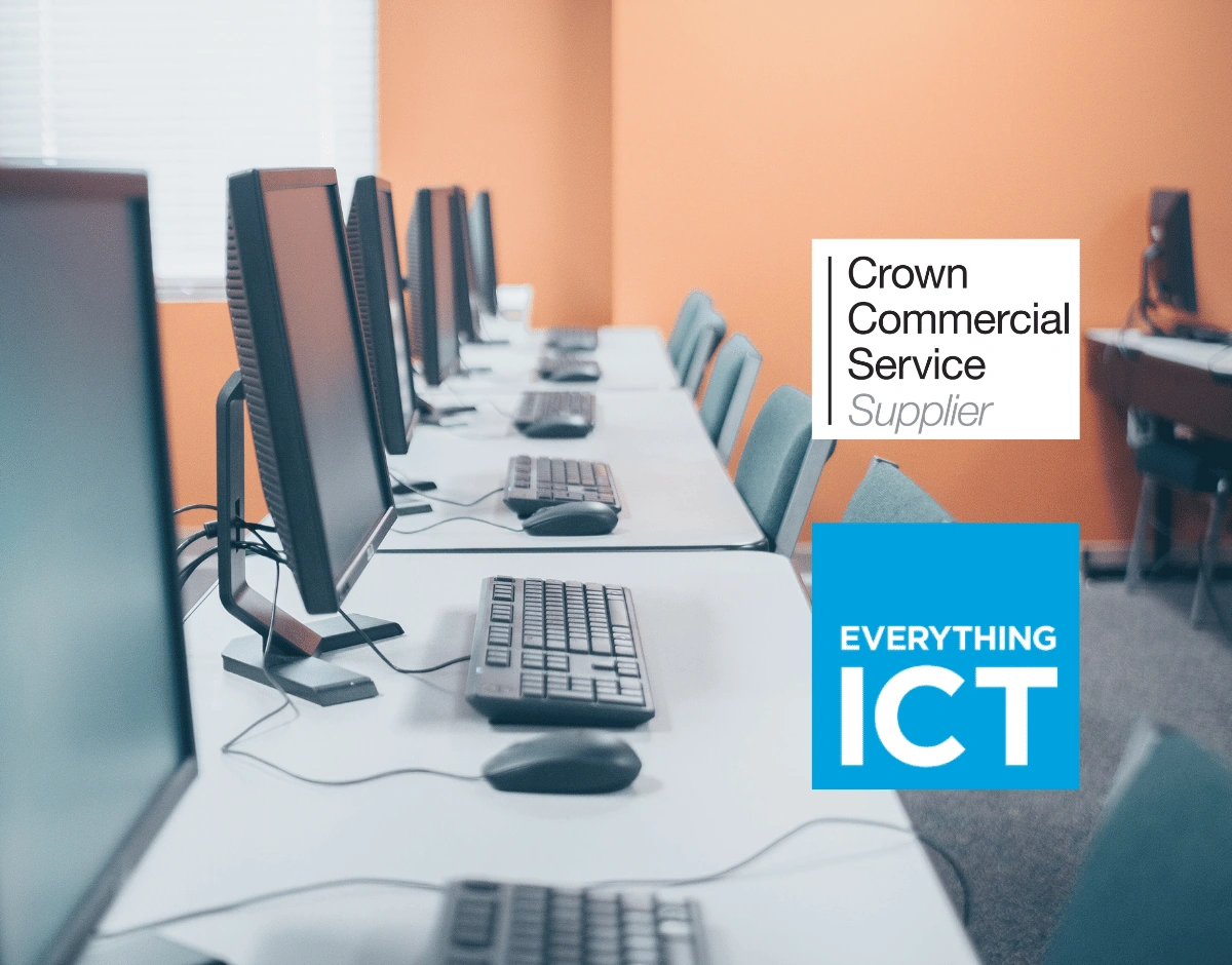 Row of computers in a classroom with Crown Commercial Service Supplier and Everything ICT procurement framework badges