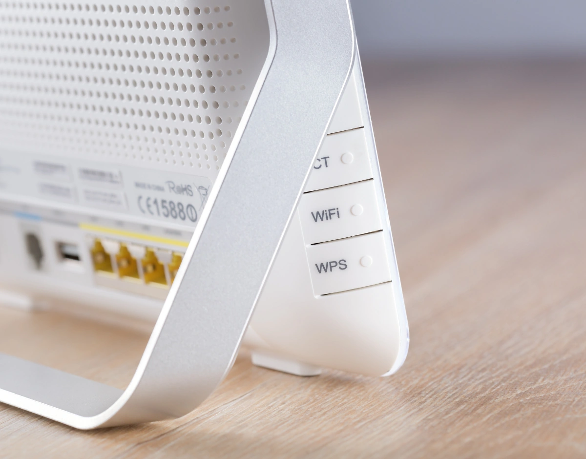 Close-up of a business WiFi router with Ethernet ports, representing broadband and connectivity services