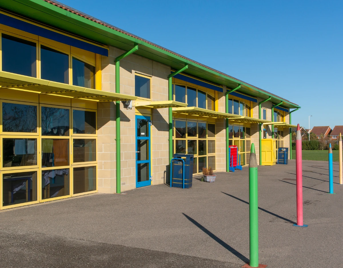 Colourful primary school building exterior, representing IT support for schools and education