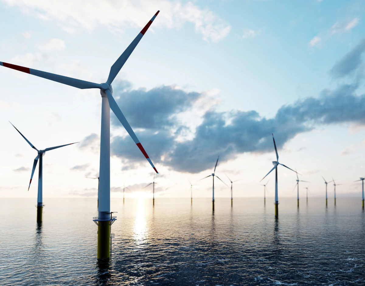 Offshore wind turbines at sea, representing IT support for renewables and energy