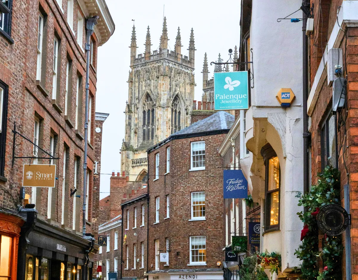 York Minster seen from a historic shopping street in York